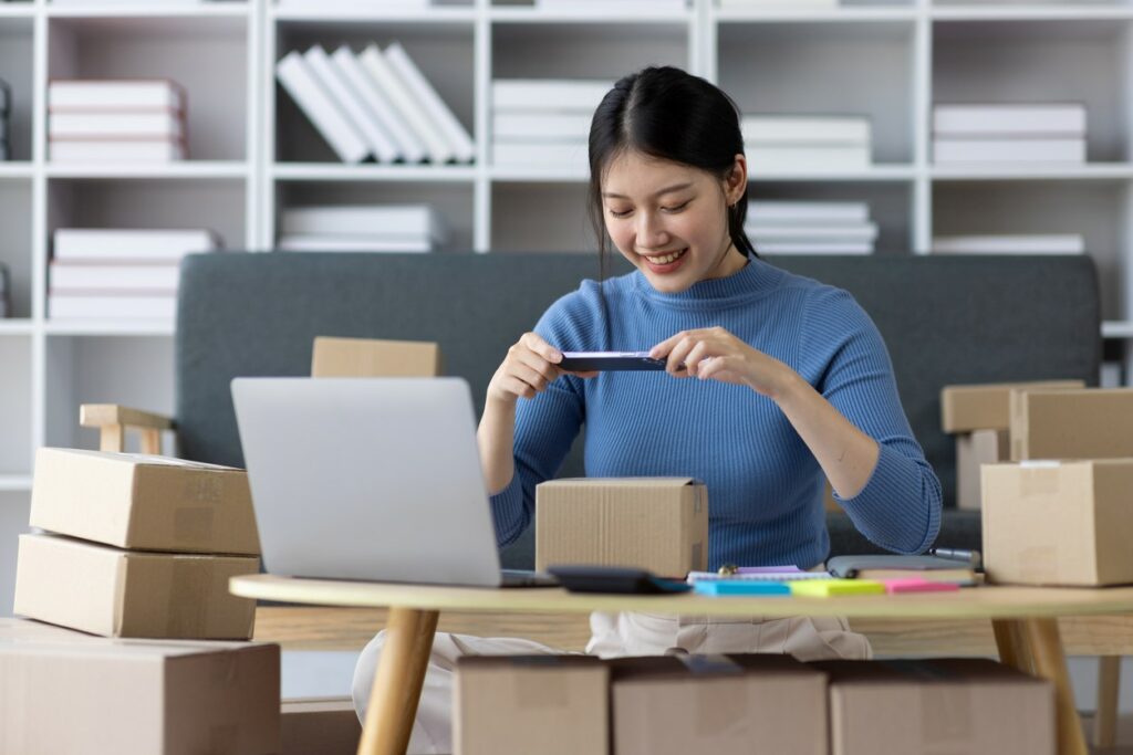 Woman at home organizing items for storage.